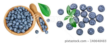 blueberry in wooden bowl isolated on white background. Top view. Flat lay. blueberry in wooden bowl isolated on white background. Top view. Flat lay. 140648483