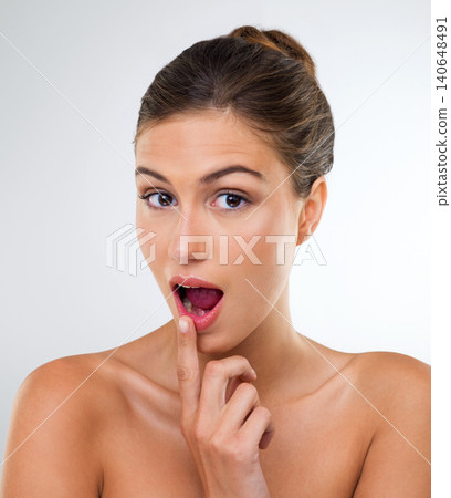 Woman, portrait and lipstick with surprise for beauty skincare on a white studio background. Face of attractive female person, brunette or model with cosmetics for facial treatment, glow or shine Woman, portrait and lipstick with surprise for beauty skincare on a white studio background. Face of attractive female person, brunette or model with cosmetics for facial treatment, glow or shine 140648491