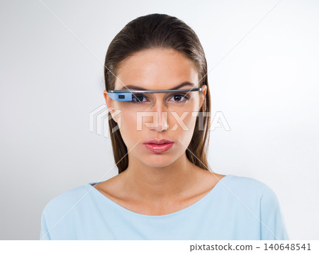 Portrait, woman and futuristic glasses for augmented reality, metaverse or serious in studio isolated on white background. Face, cyber eyewear and smart tech, virtual or digital spectacles for vision Portrait, woman and futuristic glasses for augmented reality, metaverse or serious in studio isolated on white background. Face, cyber eyewear and smart tech, virtual or digital spectacles for vision 140648541