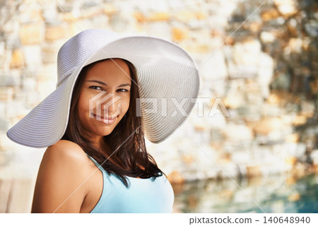 Smile, sun hat and portrait of woman at resort for summer holiday, travel and break by pool. Relax, happy and female person with happiness for vacation, weekend trip or luxury retreat for wellness Smile, sun hat and portrait of woman at resort for summer holiday, travel and break by pool. Relax, happy and female person with happiness for vacation, weekend trip or luxury retreat for wellness 140648940
