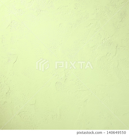 A square background image of a plaster wall with trowel marks, illuminated by a pale yellowish-green light. A square background image of a plaster wall with trowel marks, illuminated by a pale yellowish-green light. 140649550