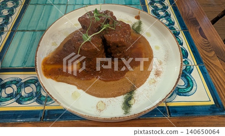 Bragioli, one of a traditional Maltese dish of braised stuffed beef Bragioli, one of a traditional Maltese dish of braised stuffed beef 140650064