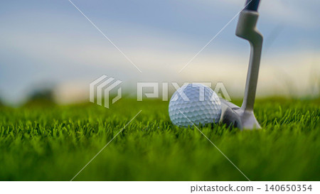Golf clubs and balls on a green lawn in a beautiful golf course with morning sunshine. 140650354