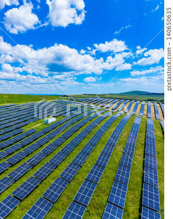 Transforming rural terrain to include sustainable power generation methods. Farmlands modified to combine traditional agriculture with environmentally friendly energy solutions 140650635