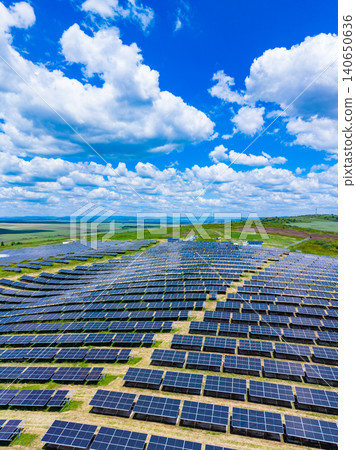 Vast solar array supporting climate action goals, continuous rows stretching to horizon, reflective highlights, potential for megawatt generation, strategic renewable investment 140650636