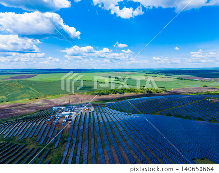 Construction site with solar panels. Development of solar array and site logistics. Active construction with earthworks and transportation infrastructure visible Construction site with solar panels. Development of solar array and site logistics. Active construction with earthworks and transportation infrastructure visible 140650664