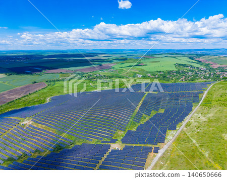 Solar installations blending into countryside vistas peacefully. Community sustainable energy solutions integrated within natural rural environments peacefully and efficiently Solar installations blending into countryside vistas peacefully. Community sustainable energy solutions integrated within natural rural environments peacefully and efficiently 140650666