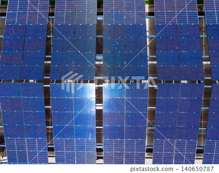 Solar panels arranged in rows on a rooftop in a sunny location showcasing clean energy technology in action for future power generation Solar panels arranged in rows on a rooftop in a sunny location showcasing clean energy technology in action for future power generation 140650787