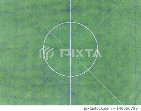 Soccer field layout showing center circle and midline during sunny day in a local park or sports complex Soccer field layout showing center circle and midline during sunny day in a local park or sports complex 140650789
