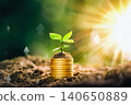 Growing Money - Plant On Coins - Finance And Investment Concept. The seedlings are growing on the coins placed on the ground, thinking about financial growth. Savings Coins. Interest Concept. 140650889