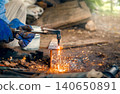 Cutting steel with gas, gas welding and oxy-fuel cutting are processes that use fuel gases and oxygen to weld and cut metals, respectively. industrial worker cutting thick steel in workshop. 140650891