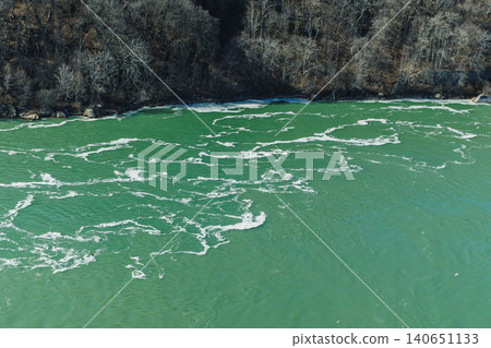 View of the water currents and shoreline near Niagara Falls during a bright day in early spring View of the water currents and shoreline near Niagara Falls during a bright day in early spring 140651133