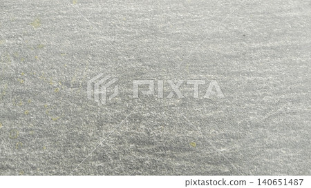 Textured grey ceramic paving tile background with white paint splatters Textured grey ceramic paving tile background with white paint splatters 140651487