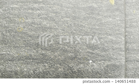 Textured grey ceramic paving tile background with white paint splatters Textured grey ceramic paving tile background with white paint splatters 140651488