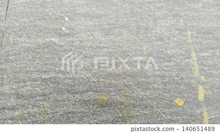 Textured grey ceramic paving tile background with white paint splatters 140651489