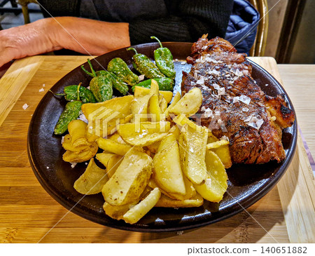 Local food in a restaurant in Jaca, Huesca province, Aragon in Spain. Local food in a restaurant in Jaca, Huesca province, Aragon in Spain. 140651882