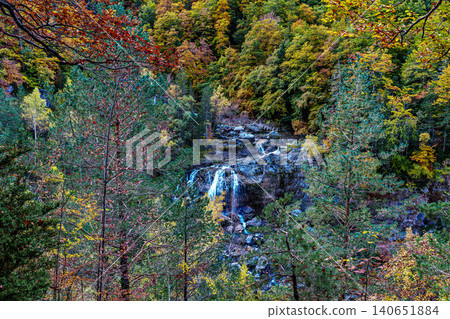 Waterfall on the Hunter's Trail in autumn. Ordesa and Monte Perdido Natural Park, Pyrenees, Spain Waterfall on the Hunter's Trail in autumn. Ordesa and Monte Perdido Natural Park, Pyrenees, Spain 140651884
