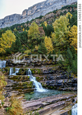 Waterfall on the Hunter's Trail in autumn. Ordesa and Monte Perdido Natural Park, Pyrenees, Spain Waterfall on the Hunter's Trail in autumn. Ordesa and Monte Perdido Natural Park, Pyrenees, Spain 140651888