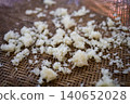 Cooked Sticky Rice Scattered on Woven Bamboo Tray Close-Up 140652028