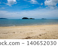 Tropical Sandy Beach with Islands and Turquoise Sea Under Blue Sky 140652030