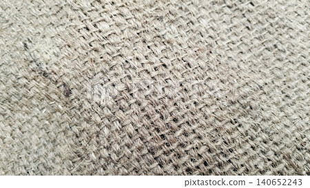 Close-up of rough hessian cloth surface, organic jute textile backdrop Close-up of rough hessian cloth surface, organic jute textile backdrop 140652243