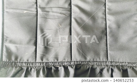 Close-up of dark black textile surface, elegant drapery material backdrop. Close-up of dark black textile surface, elegant drapery material backdrop. 140652253