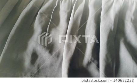 Close-up of dark black textile surface, elegant drapery material backdrop. Close-up of dark black textile surface, elegant drapery material backdrop. 140652258