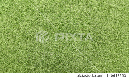 Green artificial grass texture background for modern landscaping. Green artificial grass texture background for modern landscaping. 140652260