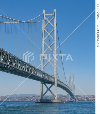 The main towers and suspension bridge structure of the Akashi Kaikyo Bridge spanning the Akashi Strait. The main towers and suspension bridge structure of the Akashi Kaikyo Bridge spanning the Akashi Strait. 140652457