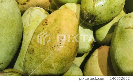 Pile of organic ripe sweet mango fruits at local market Pile of organic ripe sweet mango fruits at local market 140652662