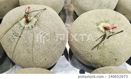 Fresh whole cantaloupe muskmelons background on display at market. Fresh whole cantaloupe muskmelons background on display at market. 140652673