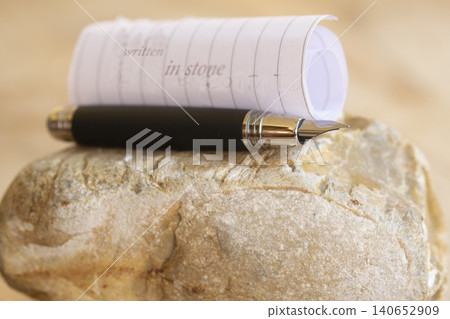 Written in stone text on paper with luxury fountain pen 140652909