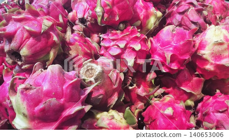 Close-up of fresh whole pink dragon fruits background Close-up of fresh whole pink dragon fruits background 140653006