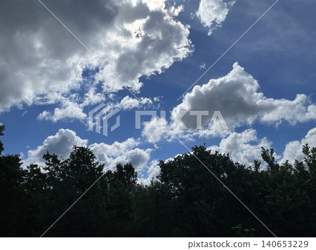 Summer clouds over rural village Summer clouds over rural village 140653229