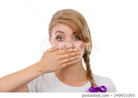 Sad woman covering mouth with hand Sad woman covering mouth with hand 140653393