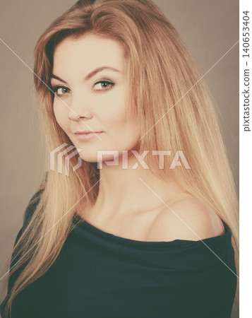 Portrait of happy blonde woman smiling with joy Portrait of happy blonde woman smiling with joy 140653404