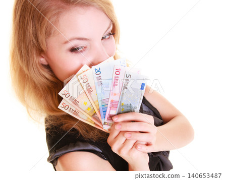 Economy finance. Woman holds euro currency money. Economy finance. Woman holds euro currency money. 140653487