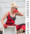 Female builder working build new house 140653501
