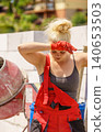 Heavy working woman on construction site 140653503