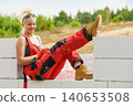 Woman taking break on construction site 140653508