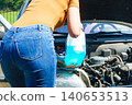 Pouring antifreeze liquid for washing car screen 140653513