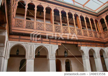 Interior courtyard of the Nejjarine Museum showcasing carved wooden balconies and traditional architecture in Fez 140653556