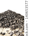 Dark coal piles form a rough mound 140653577