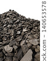 Dark coal piles form a rough mound 140653578
