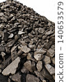 Dark coal piles form a rough mound 140653579