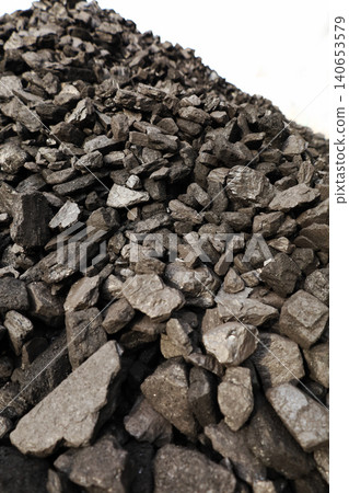 Dark coal piles form a rough mound Dark coal piles form a rough mound 140653579