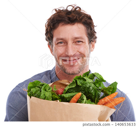 Studio, happy and portrait of man with groceries on promotion, sale or discounts deal on nutrition. Smile, delivery offer and male person with healthy food for cooking, organic fruits or diet choice Studio, happy and portrait of man with groceries on promotion, sale or discounts deal on nutrition. Smile, delivery offer and male person with healthy food for cooking, organic fruits or diet choice 140653633