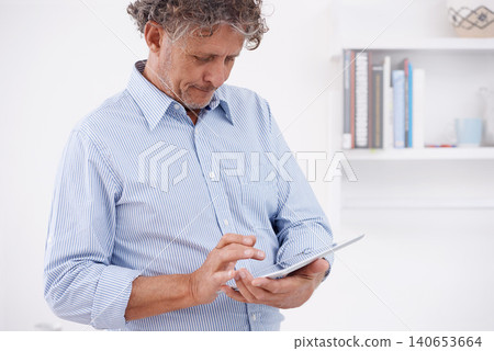 Man, tablet and office for research, internet and online with technology for business or job. Executive with tech and finger on screen for browse with website with wifi for profession or work 140653664