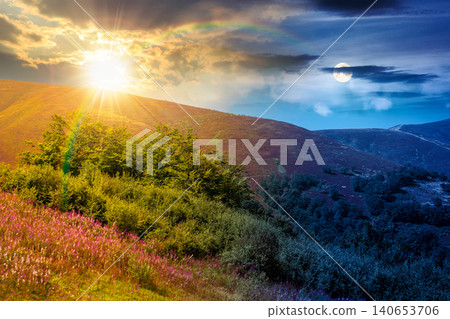 carpathian mountain landscape. travel ukraine on summer solstice. slopes mountain ridge in august at twilight. wonderful carpathian adventure with sun and moon on epic sky carpathian mountain landscape. travel ukraine on summer solstice. slopes mountain ridge in august at twilight. wonderful carpathian adventure with sun and moon on epic sky 140653706