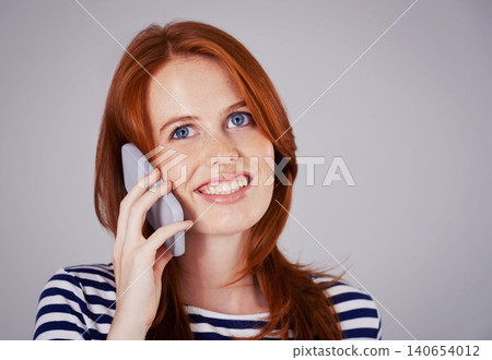 Woman, phone call and network for communication in studio, internet and smile for conversation or chat. Happy female person, mockup space and voip for speaking on gray background, talking and online Woman, phone call and network for communication in studio, internet and smile for conversation or chat. Happy female person, mockup space and voip for speaking on gray background, talking and online 140654012